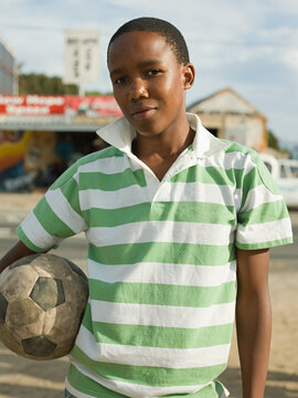 Teenage african boy with football