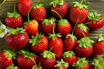 Fresh ripe strawberry with water drops on black background. Macro image. High quality photo