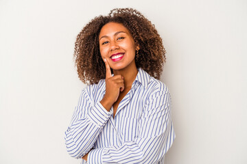 Fototapeta na wymiar Young african american woman with curly hair isolated on white background smiling happy and confident, touching chin with hand.