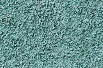 close up of turquoise plaster