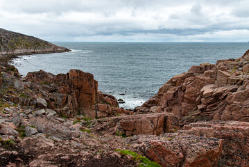 Fototapeta na wymiar rocky coast of the North Sea with rocks. View from the mountain.Teriberka, Barents Sea, Murmansk region, Kola Peninsula
