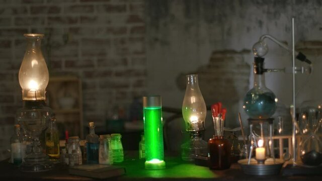 A dimly lit 19th century laboratory with a bubbling potion and a spooky glowing green substance.