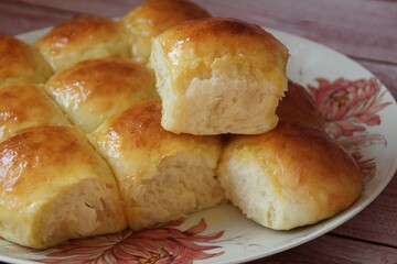 homemade yeast buns, brioche buns, glowing buns, homemade baked goods on a plate