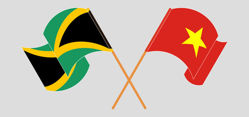 Crossed and waving flags of Jamaica and Vietnam