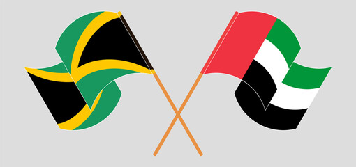 Crossed and waving flags of Jamaica and the United Arab Emirates