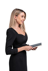 Young attractive businesswoman wearing black dress is standing, holding notebook