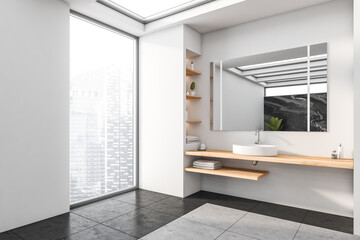 Fototapeta premium Bright bathroom interior with large mirror, concrete floor, panoramic window