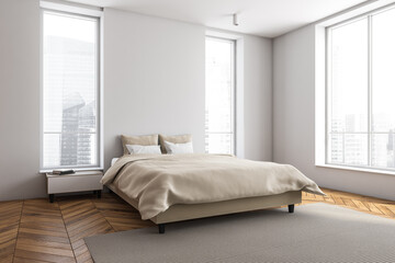 Fototapeta na wymiar Contemporary white and beige bedroom. Corner view.