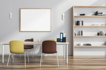 Empty canvas on white wall of creative workspace