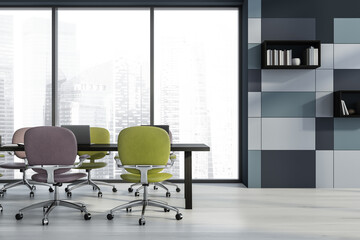 Blue conference room with green and violet office chairs