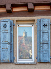 Obraz na płótnie Canvas Townscape of Schwäbisch Hall in Germany with church mirroring in the window of an old building