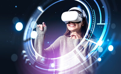Smiling businesswoman in green sweater wearing vr helmet