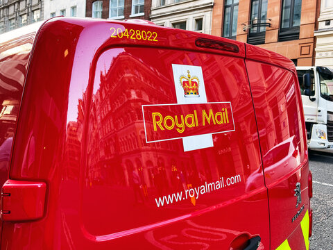 London, England - August 2021: Close up of the Royal Mail logo on the back of a delivery van