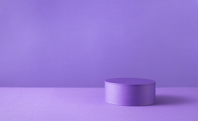 Podium or pedestal for products display on purple background.