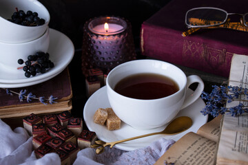 old books, tea, glasses