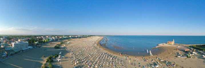 Spiaggia di Caorle - Vista panoramica dall'alto  in estate sul Santuario Madonna dell'Angelo in...