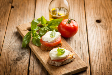bruschetta with mozzarella tomato basil  and olive oil