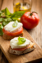 bruschetta with mozzarella tomato basil  and olive oil