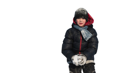 Fototapeta na wymiar A little boy plays in the snow in winter