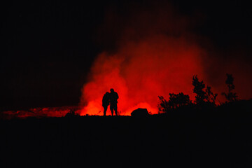 Fototapeta na wymiar Couple in front of volcanic eruption