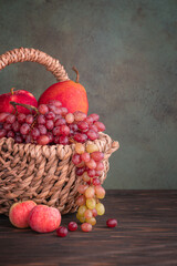 Fresh ripe fruits in wicker basket
