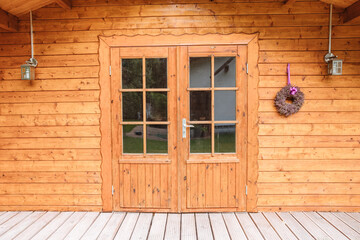 Wooden house in the garden or in the forest. Build with wood. Garden shed 