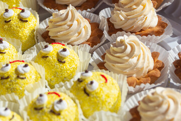 Cakes with eyes and smiles. Fresh baked cakes for children.