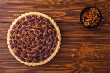 Traditional American autumn dessert . Pecan pie