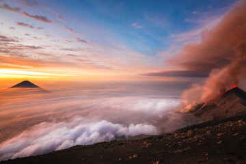 Volcano Erupting above sea of clouds in Guatemala eruption sunrise