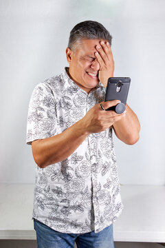 Surprised adult man with cell phone pictures, expressions