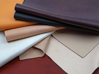 Natural leather textures samples on brown leather background