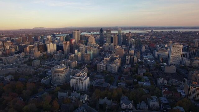 4K aerial drone shot of montreal skyline high forward move at sunset