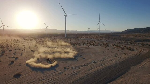 4K Aerial of ATV riding fast through California Desert doing donuts fun 