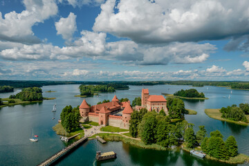 Fototapeta na wymiar Aerial view of Trakai Island Castle - a medieval gothic castle located in Lithuania, on an island in Lake Galve. The construction begun in the 14th century and around 1409 major works were completed
