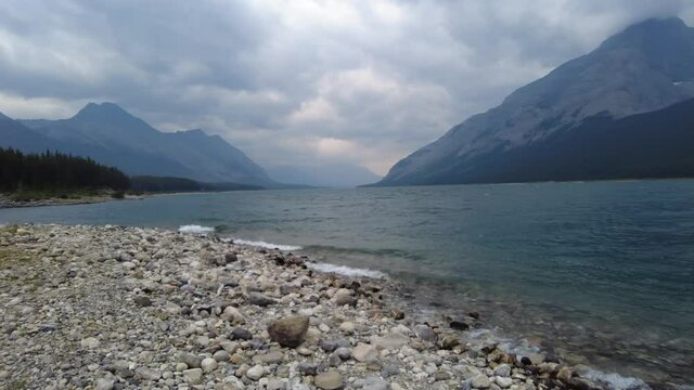 Spray Lakes Reservoir in Kananaskis, Alberta, Canada on a stormy cloudy day. Man-made reservoir surrounded by Canadian Rocky Mountains near Canmore and Banff. 