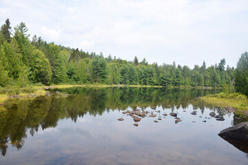 Lake Dunbar, Reserve Faunique du Saint-Maurice, Quebec, Canada: Reflections of trees in lake near the Dunbar Waterfalls (Chutes Dunbar)
