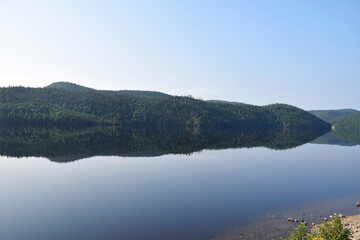 Lake Résimond, Quebec, Canada: View of perfectly still morning reflections on the lake