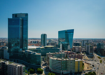 Fototapeta premium Aerial view of skyline of Porto Nuova district in Milan. Office building on other skyscrapers in horizon