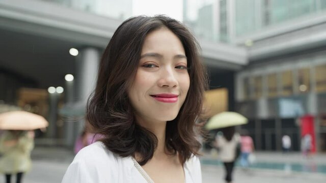 close up portrait of beautiful asian woman looking at camera smile