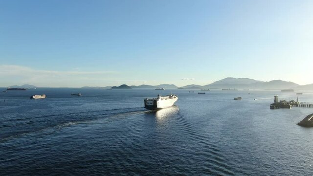 RoRo Roll on-Off vessel cruising slowly leaving Hong Kong bay.