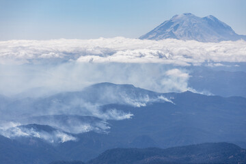 Naklejka na ściany i meble Aerial view of wildfire near Mount Rainier, Washington, USA 