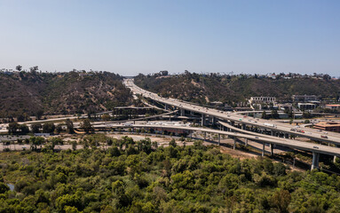 Commuters drive on San Diego Freeways. Busy California highways, aerial.