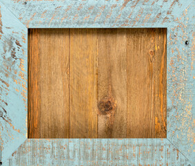 Vintage wooden frame on top of a wood board with copy space.