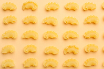 Uncooked creste pasta on color background
