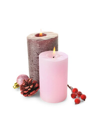 Composition with candles, pine cone and ashberries on white background