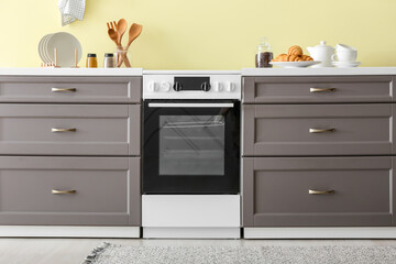 Modern counter with oven near color wall in kitchen