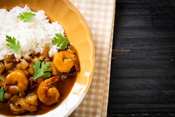 Shrimps in curry sauce on rice