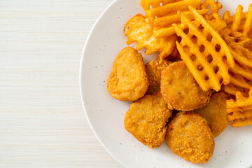 fried chicken nuggets with fried potatoes