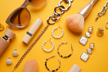Set of female accessories and cosmetics on color background, closeup