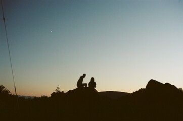 silhouette of a couple who were sunset gazing